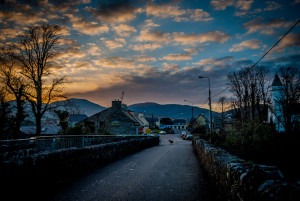 image of dog on Sneem bridge at sunset by Penny Fox